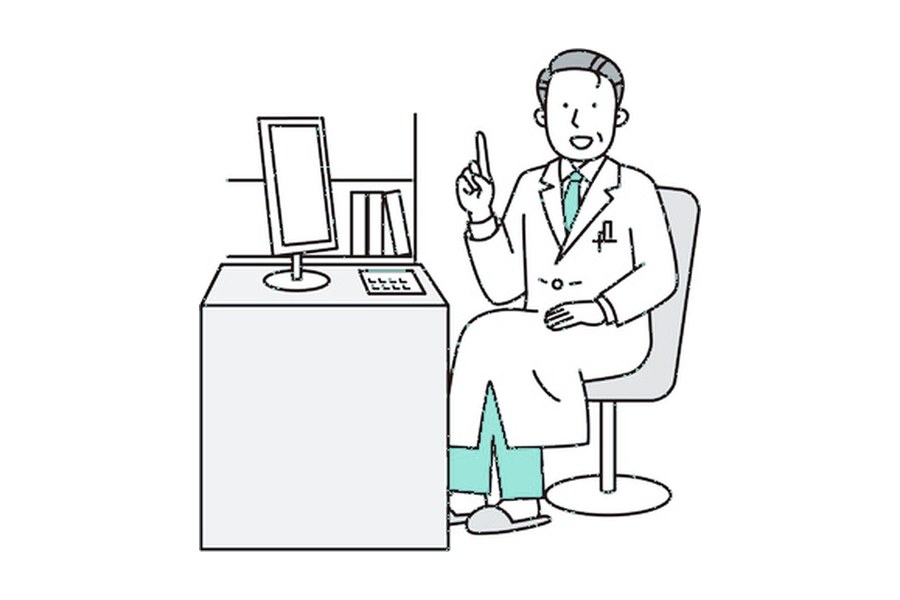 診察室の机の前に座る医師のイラスト